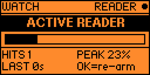 Watch mode with an active reader: inverted ACTIVE READER band, 1 hit, peak 100%, now 100%
